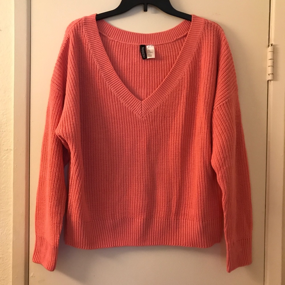 Coral colored ladies sweater, never been worn.