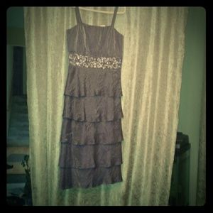 A fringed, ruffled, Embroidered cocktail dress.