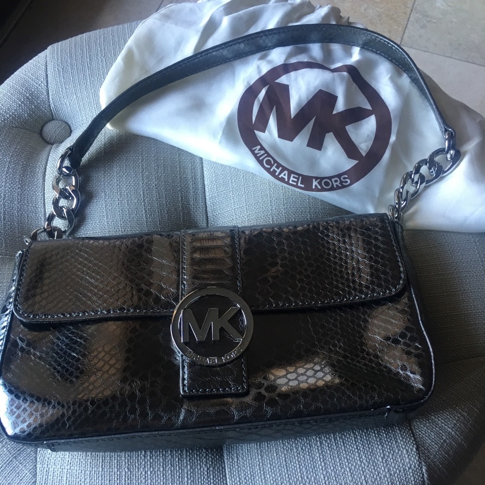 Michael Kors clutch purse with strap leather