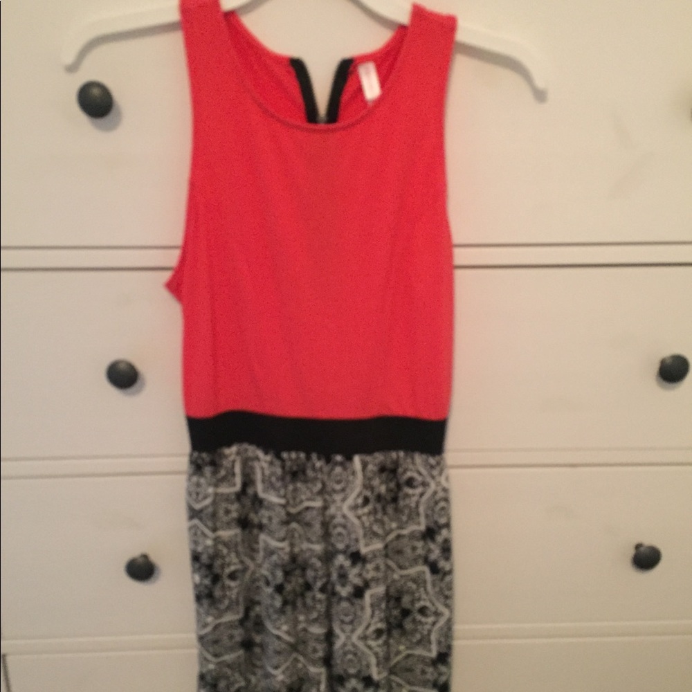 Pink/black/white romper with cut out on back.