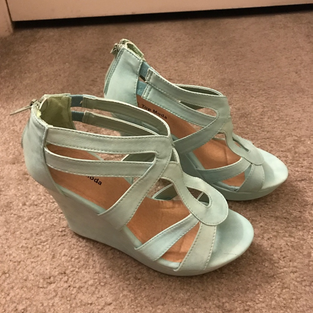 Ladies light green wedges with zip back.