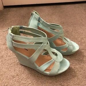 Ladies light green wedges with zip back.