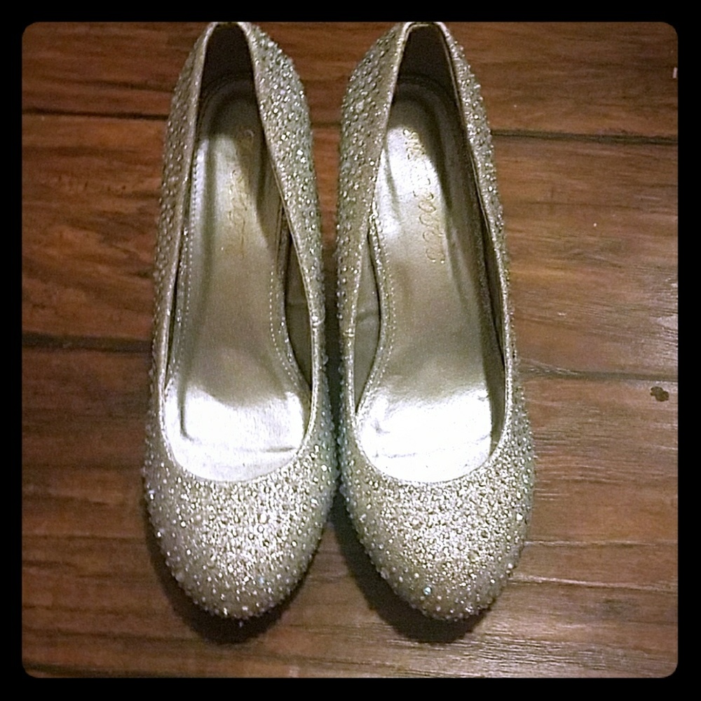Silver glitter wedge heels.