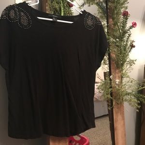 Black top with beaded accents over shoulders.