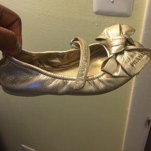 Little girls gold Prada ballet flats