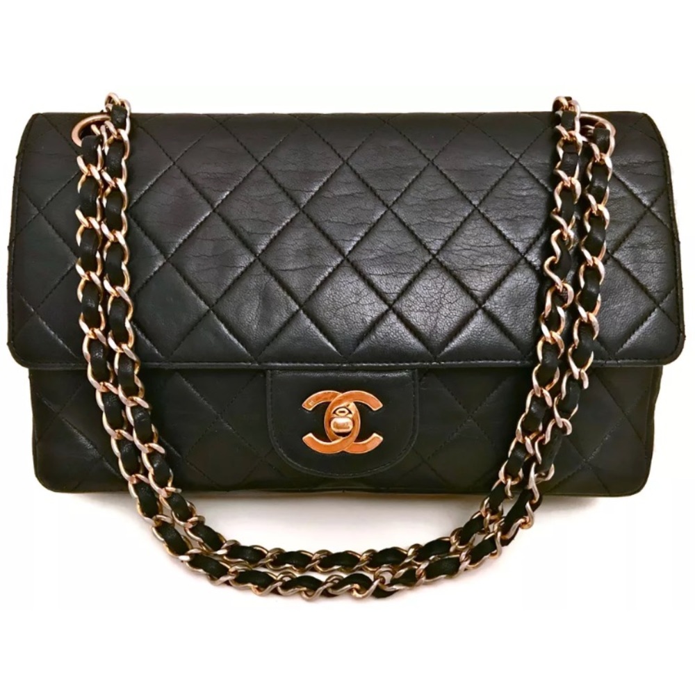 CHANEL Paris 9.75" Inch Black Quilted Flap Bag.