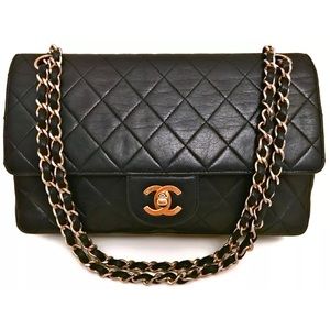 CHANEL Paris 9.75" Inch Black Quilted Flap Bag.