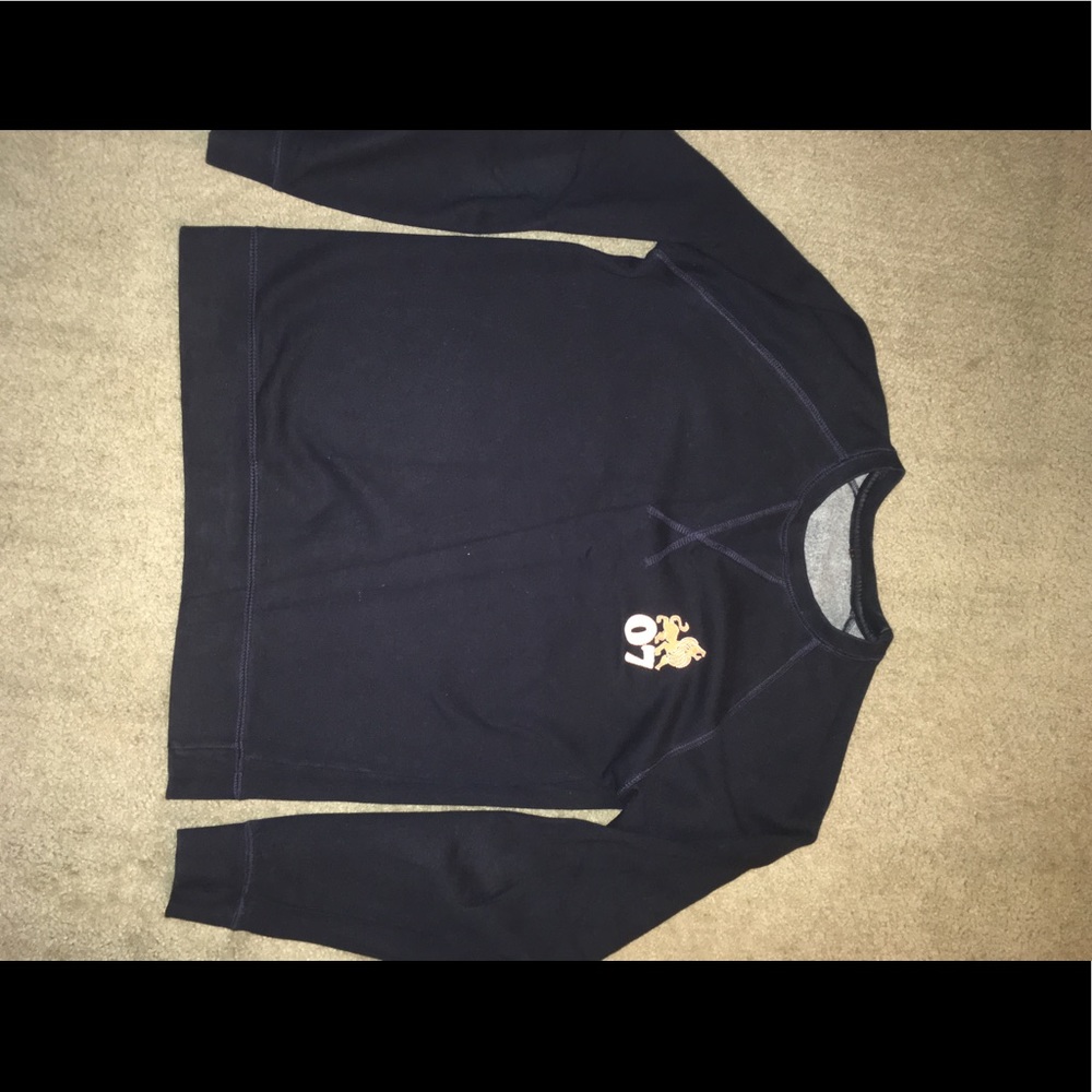 Blue thermal or sweater kind of shirt.