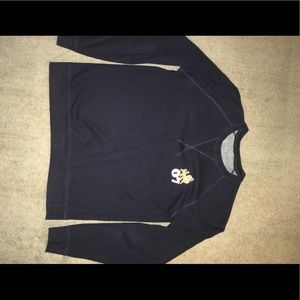 Blue thermal or sweater kind of shirt.