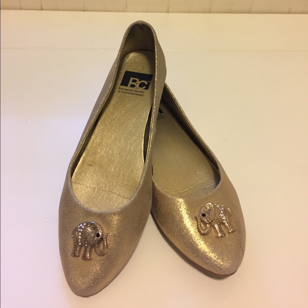 Gold flats with elephant detail embellishment