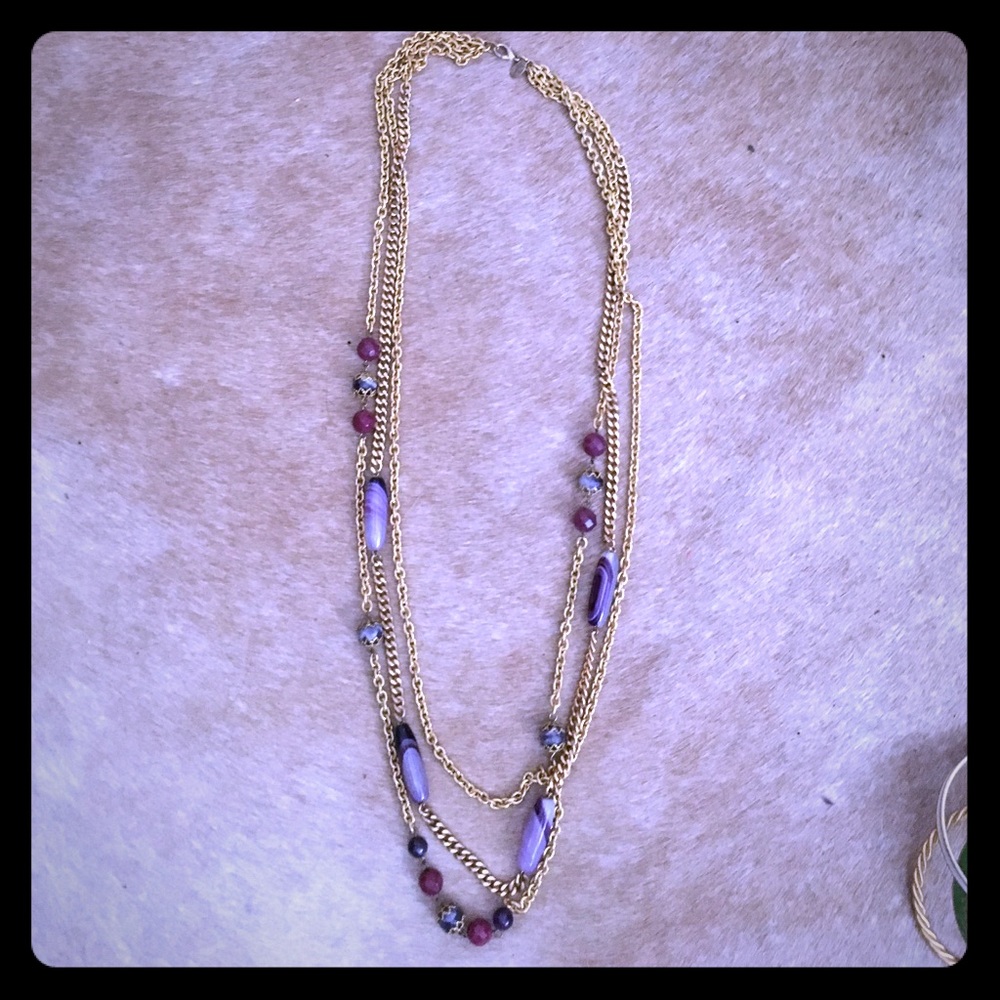 Chain-link necklace with purple beads.
