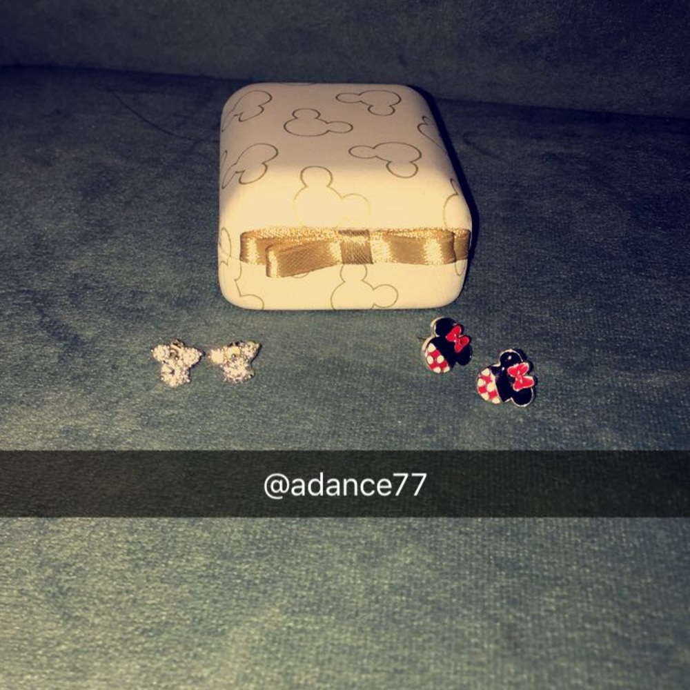 Two pairs of Mickey Mouse earrings and a box