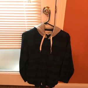 Long sleeved young men's flannel shirt w/hood.