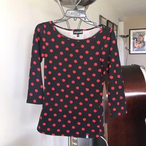 Sourpuss stretchy top.  Black with red dots.