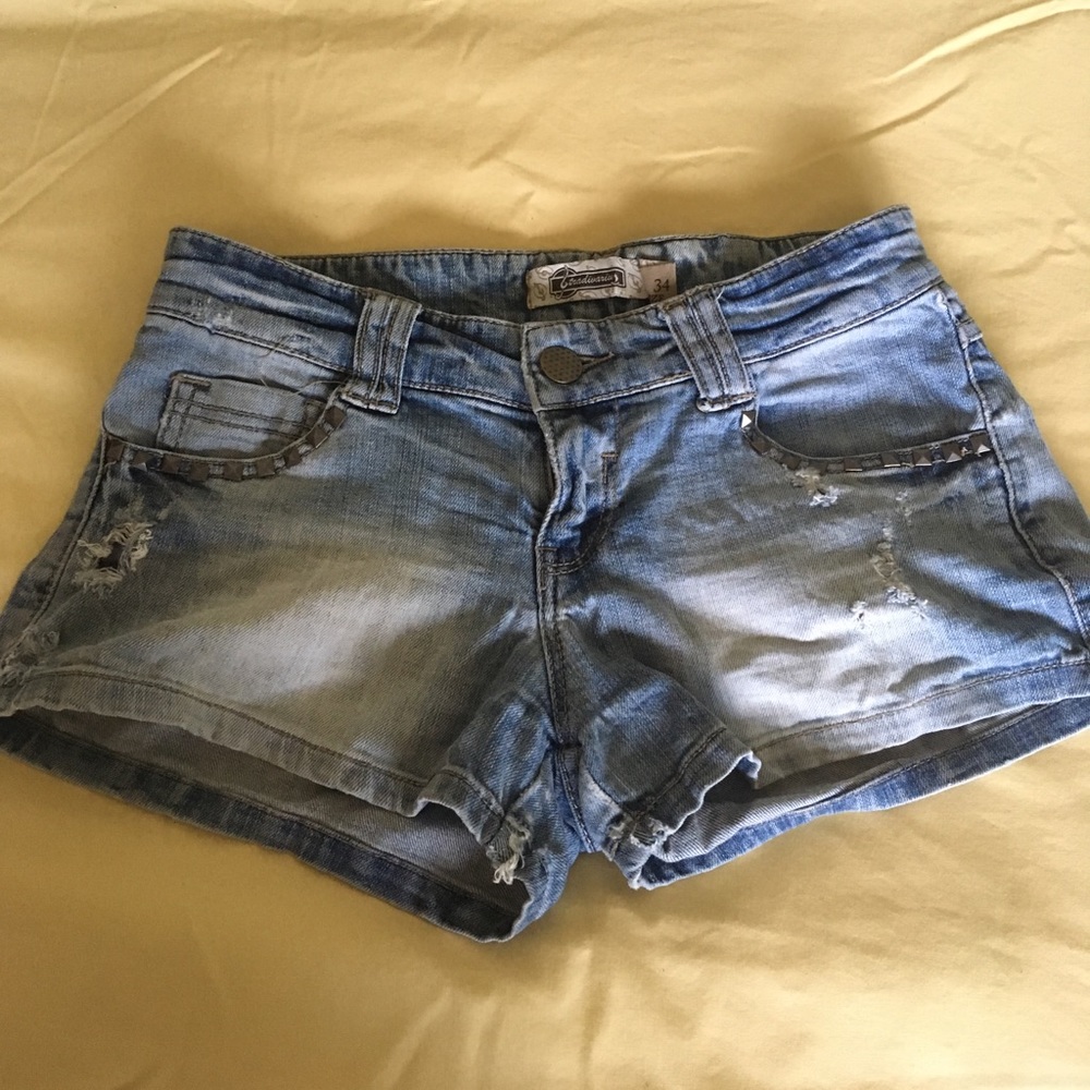 Washed out Denim shorts with pyramid studs