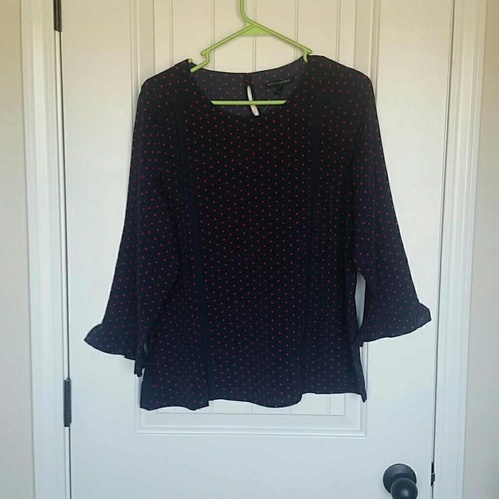 Navy and red polka-dot top