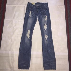 Machine Distressed Mid-Washed Jeans