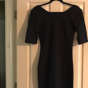 Black fitted midi dress with low back