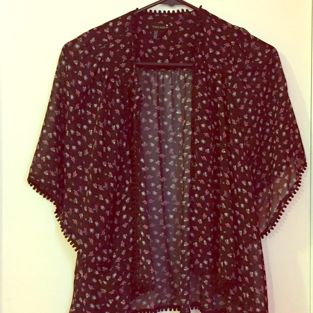 Sheer black patterned cover.