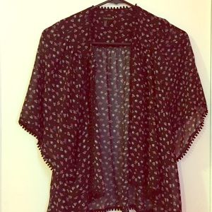 Sheer black patterned cover.