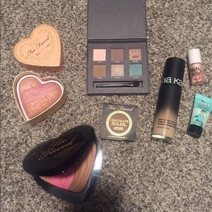 Lot of unused makeup.too faced and benefit