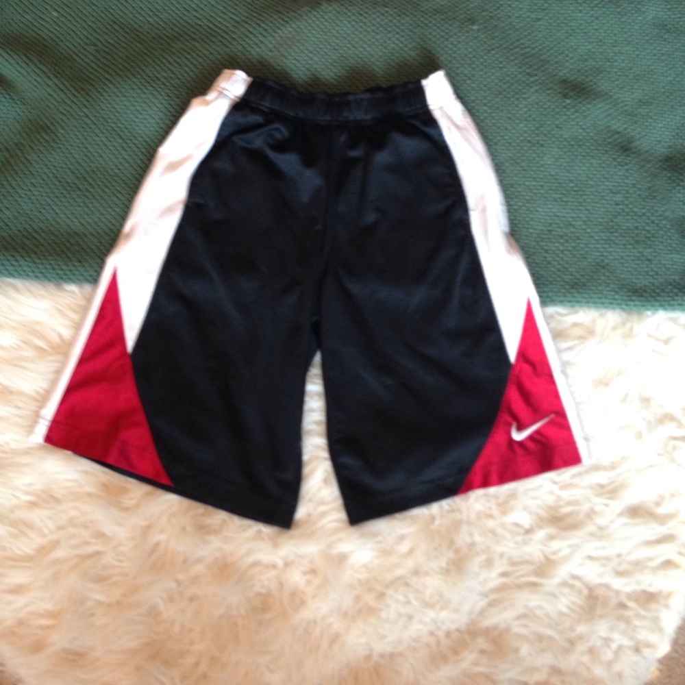 Black, white, and red Nike athletic shorts.