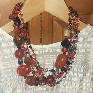 Beautiful necklace made out of red/black stones.
