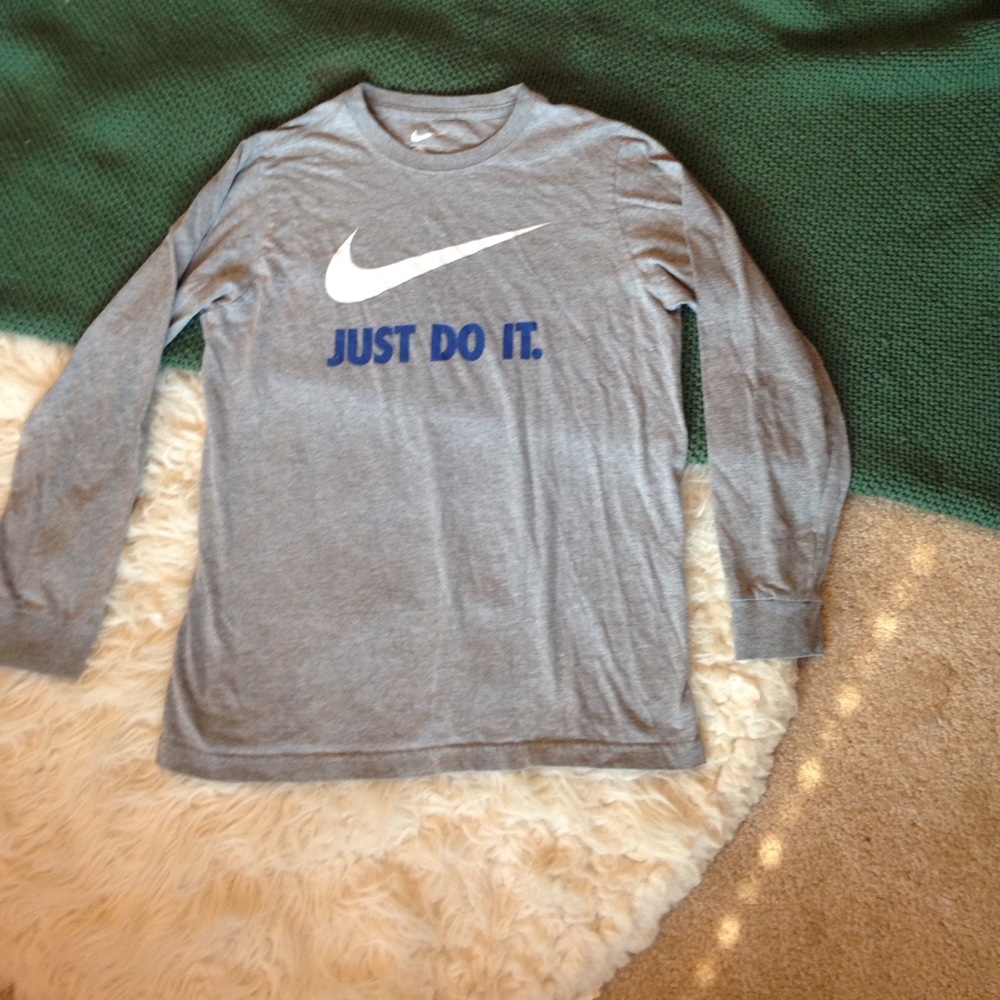 Gray long sleeve Nike shirt.