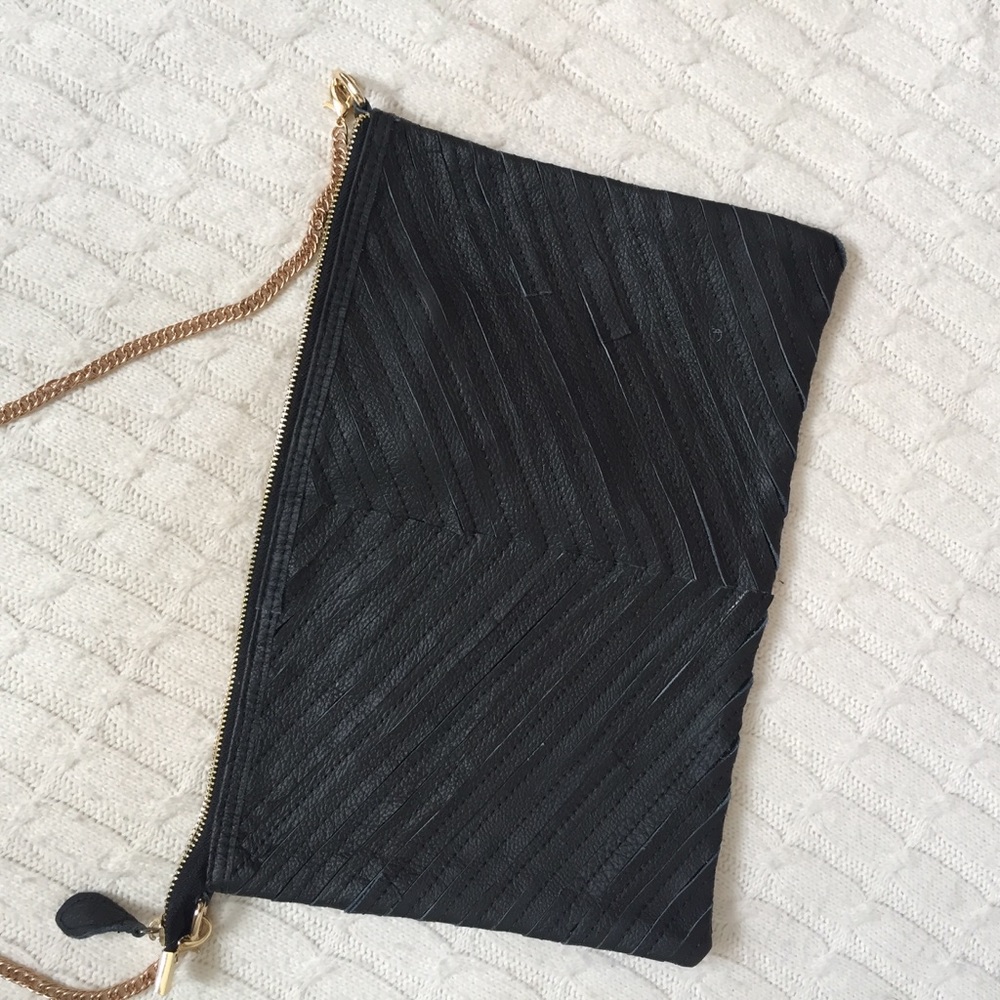 Black Fab'rik cross-body or clutch purse.