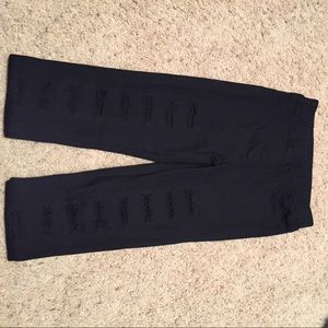 Distressed black jeggings