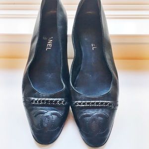 Black Chanel almond-toe flats with chain detail