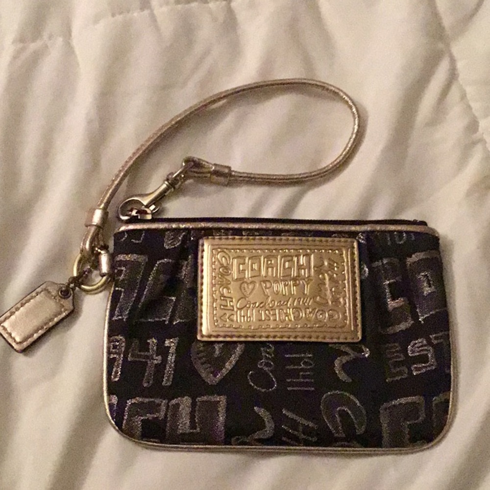 Coach black and gold wristlet