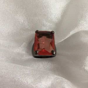 Express red ring in bronze setting