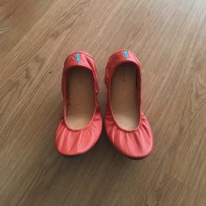 Tangerine colored Tieks size 11.