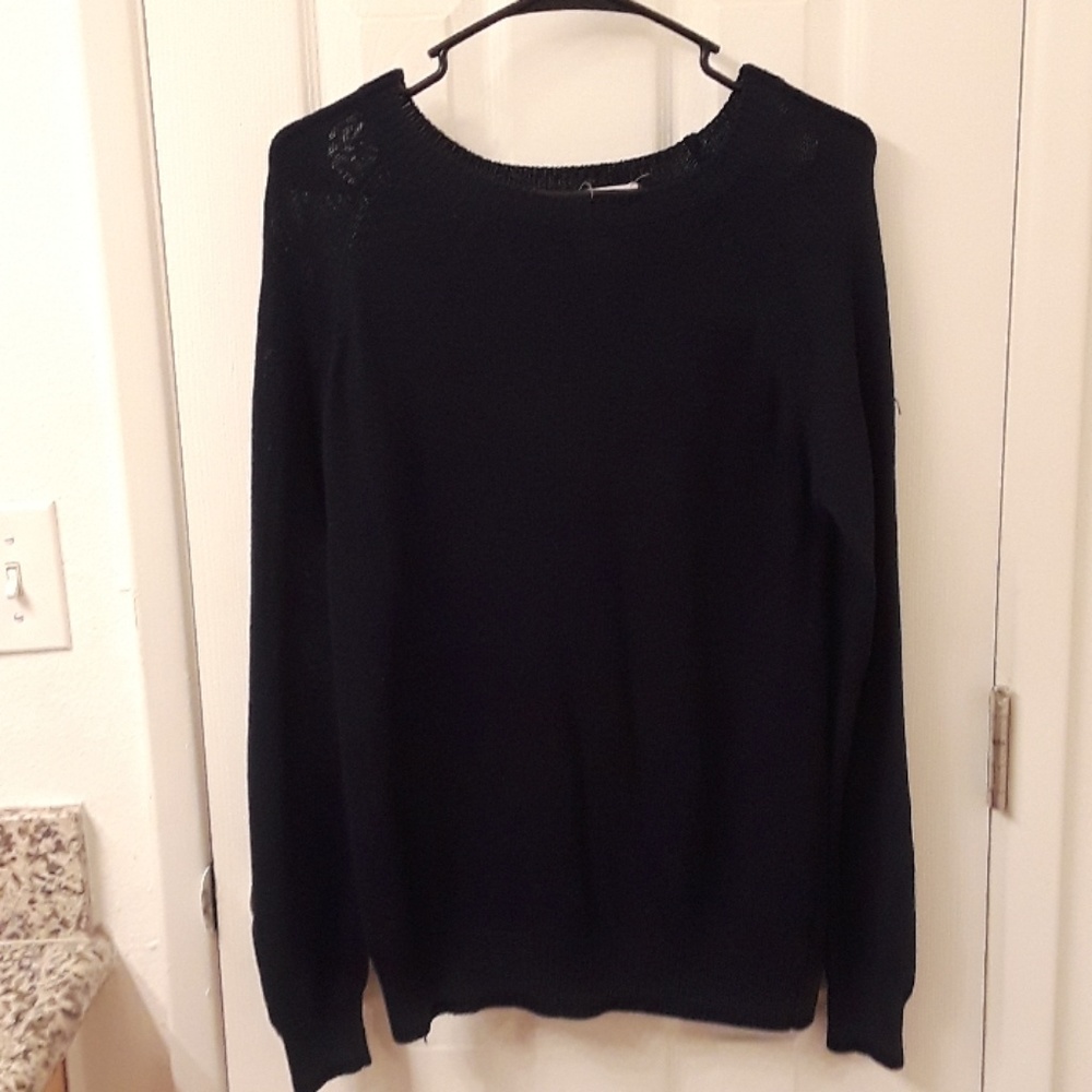 Knit sweater.