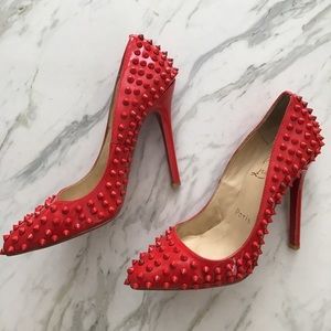 Red spike heels