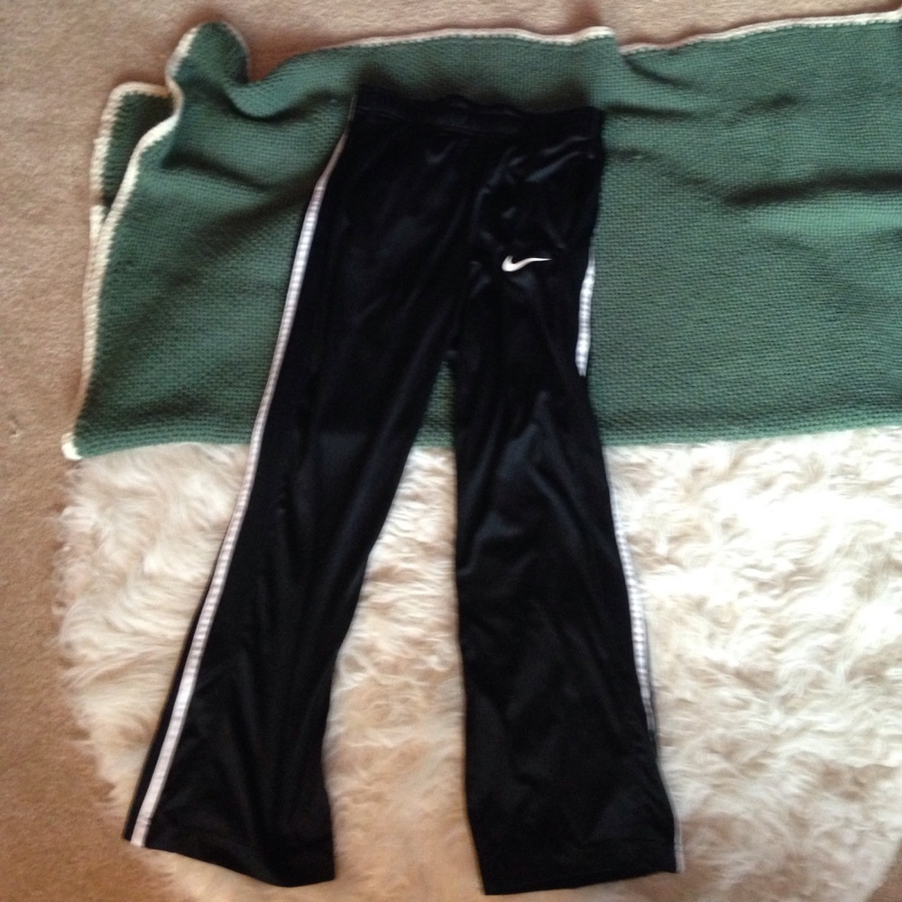Black with white stripped Nike pants.