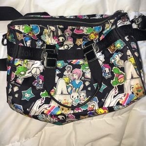 Tokidoki purse over shoulder.