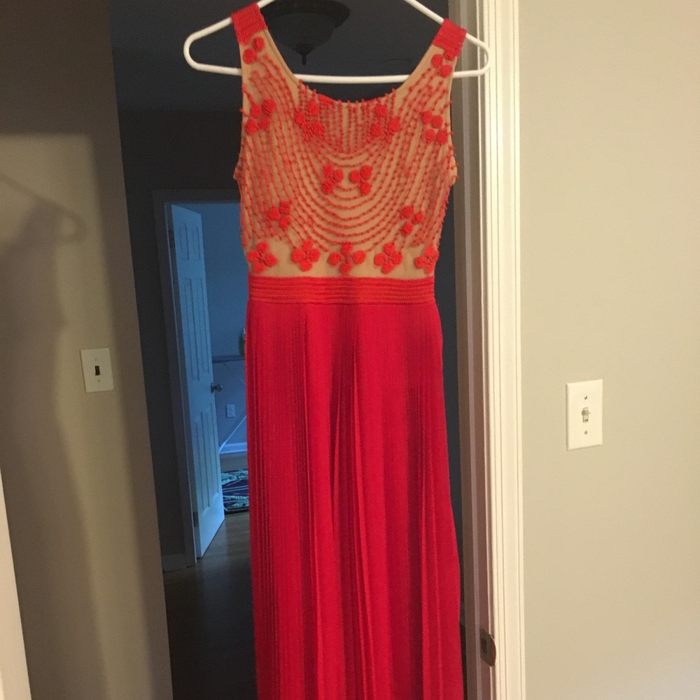 Rina Dhaka long red gown