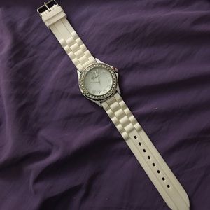 Chunky white watch with jewels on watch face
