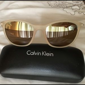 CK sunglasses gold mirror at the top of he lenses