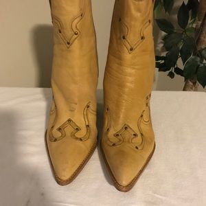 Yellow wedge cowgirl boots.