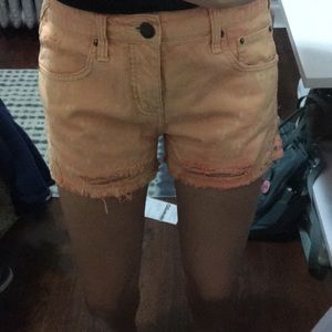 Free People Orange ripped denim shorts