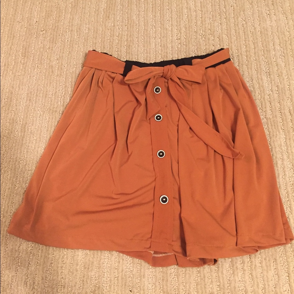 Burnt orange elastic waistband skirt with buttons