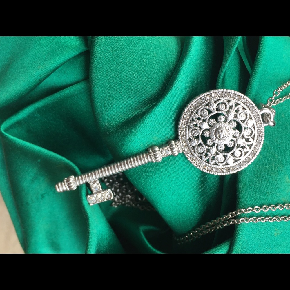 New , never worn Pave medallion key.