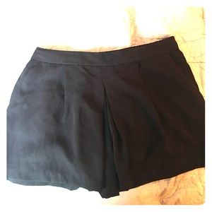 Black pleated shorts