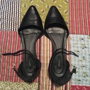 Black pointed toe flats with ankle strap