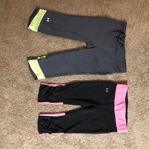 Two pairs of Under Armor workout capris.