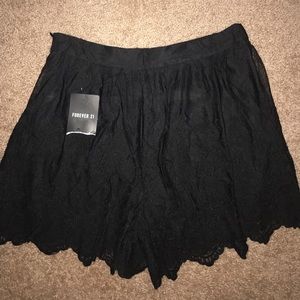 Black lace shorts.