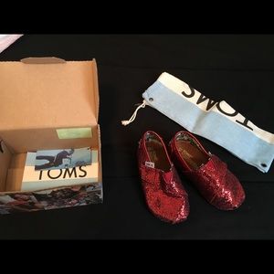Super cute red Tom's sparkly Dorothy shoes